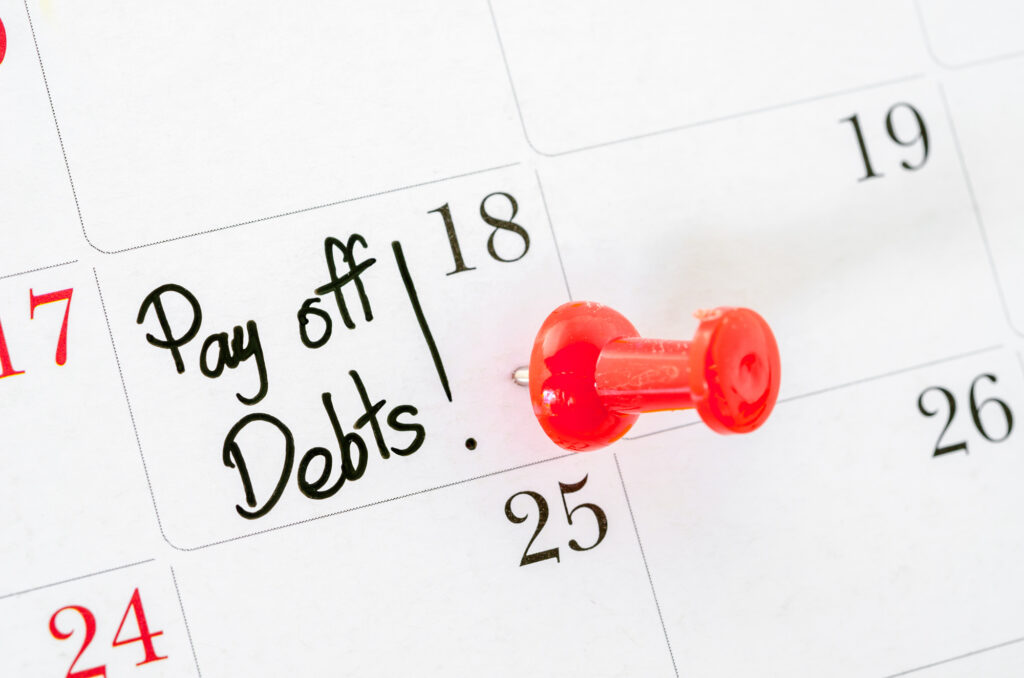 the words pay off debts written