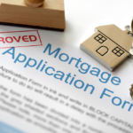 approved mortgage application form with house key